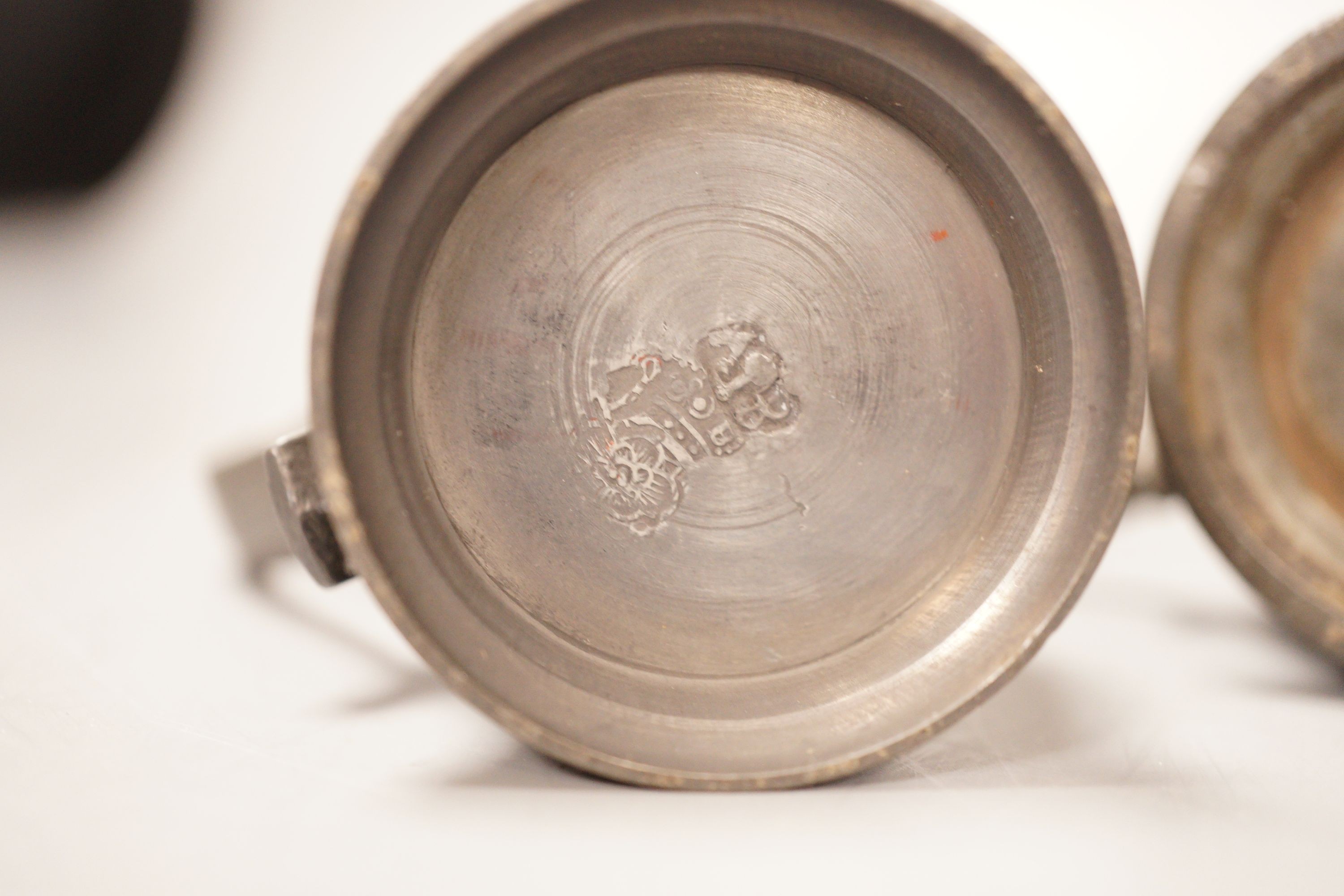 A group of 18th / 19th century pewter measures, 19cm